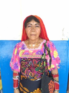 Guna Yala school teacher in her handmade outfit including the nose decoration